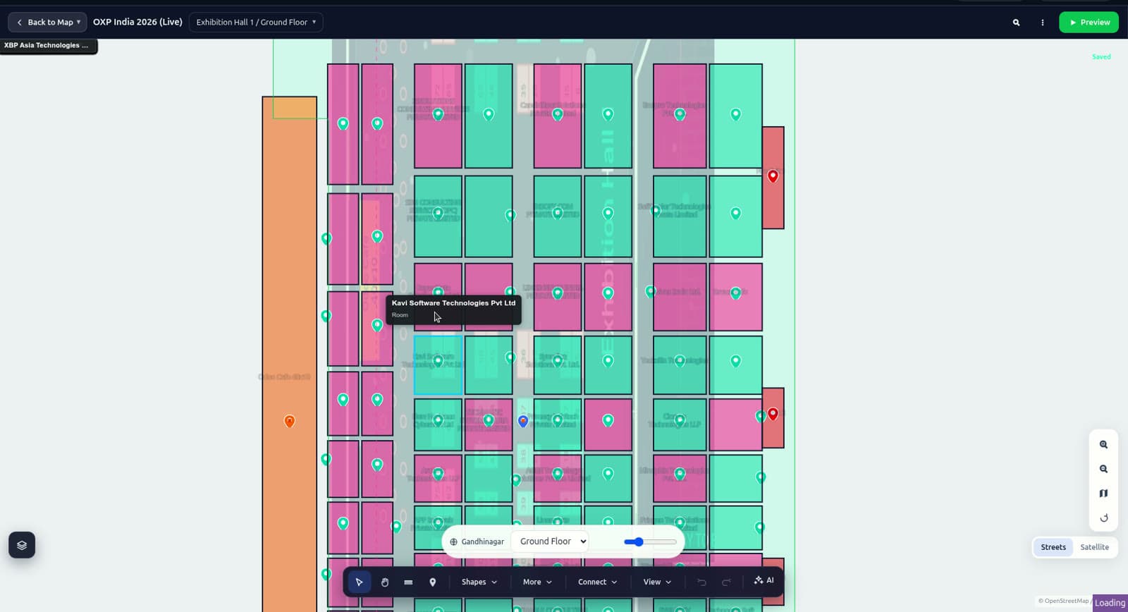 Mapnyx Studio editor over the exhibition hall with the routing graph and booth polygons, streets and satellite base map toggle.